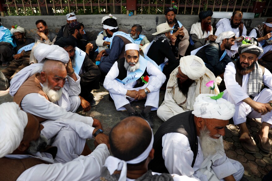 Dozens of Afghan men rest after arriving in Kabul in June 2018. The group marched hundreds of miles to demand an end to decades of conflict, from Helmand province to Kabul, and abstained from food and water during daylight hours because it was the Muslim holy month of Ramadan. As war in Afghanistan ground on throughout the decade, grassroots demands grew louder for an end to the violence.
