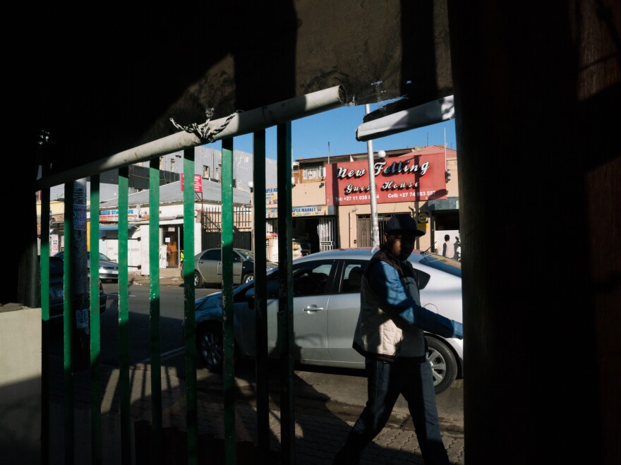 A man walks in front of a restaurant owned by a Zimbabwean expat in Johannesburg. The largest Zimbabwean diaspora community is in South Africa.