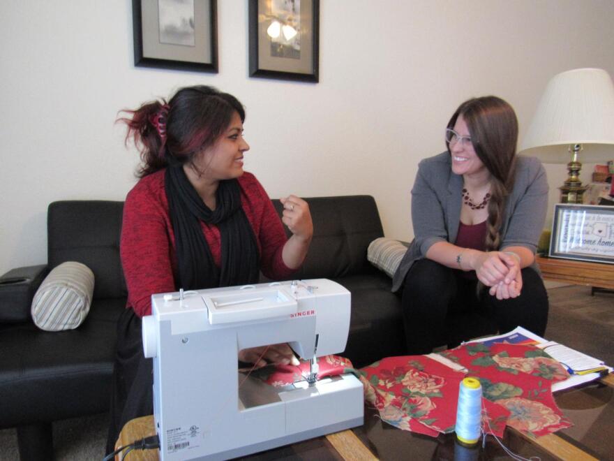 Noreen Amir (left) talks with Danielle Luna