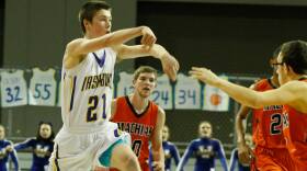 Cameron Bragg of Washburn high school passes the ball