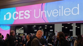 People arrive at the CES Unveiled tech show Sunday, Jan. 4, 2026, in Las Vegas. (AP Photo/Abbie Parr)