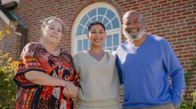 Dara Eskridge, center, stands alongside her parents Melody Eskridge, left, and Bobby Eskridge, right, outside of their home on Tuesday, Oct. 21, 2025, in University City. Invest STL’s Dara Eskridge was named to the Time100 NEXT list for her response efforts after May’s deadly EF3 tornado that ripped through north St. Louis.