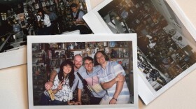 Three instant photos of band members playing a set in an office setting.