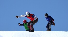 Tyler Turner, of Canada, leads Noah Elliott, of the United States, right, and Mike Schultz, of the United States, in a men's snowboard cross SB-LL1 semifinal at the 2026 Winter Paralympics, in Cortina d'Ampezzo, Italy, Sunday, March 8, 2026.