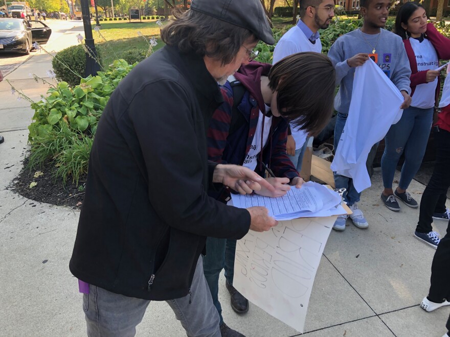 HB6 Referendum petitioner collects signatures on Otterbein University's campus.