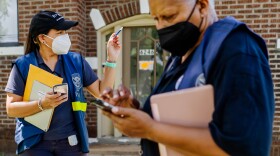 FEMA workers Wilmary Medina and Elaine Braswell canvass along Cabanne Avenue and North Drive on Wednesday in University City. 