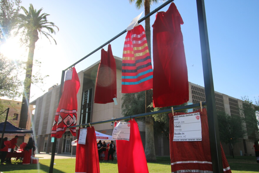 FILE - Red skirts are on display at the Arizona State Capitol in Phoenix, May 5, 2021, to raise awareness for missing and murdered Indigenous women and girls. The boyfriend of a Navajo woman whose case became emblematic of an international movement launched to draw attention to an epidemic of missing and murdered indigenous women was convicted of first-degree murder in her fatal shooting. Tre C. James, 31, was convicted Wednesday, Sept. 27, 2023 in U.S. District Court in Phoenix, in the domestic abuse and killing of his girlfriend Jamie Yazzie. (AP Photo/Cheyanne Mumphrey file)
