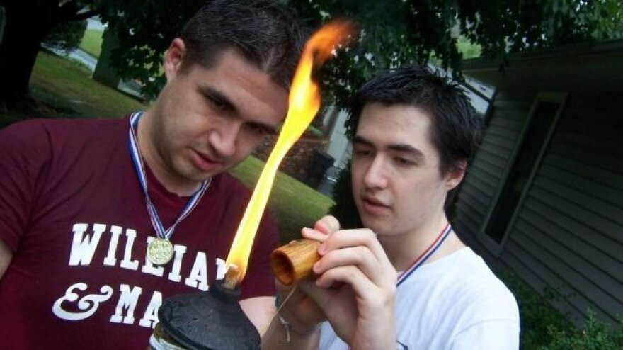 Andrew (left) and Joshua Cunningham (right) light the torch for the opening ceremony of the 2008 "Brolympics."