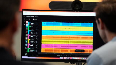 Waveforms of audio files from various instruments are displayed on a computer screen during the creation of an AI musical piece at SUNO, Tuesday, Jan. 13, 2026, in Cambridge, Mass. (Robert F. Bukaty/AP)