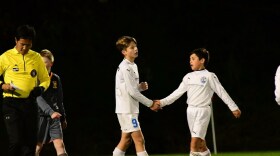 Esmir Bajraktarević (left) and Liam Wasco shake hands while playing soccer together as kids. The two have known each other since they were five.