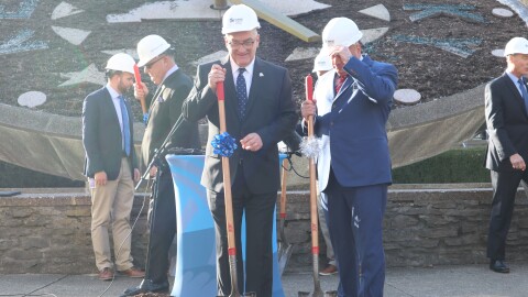 GOP Sen. Robby Mills, the co-chair of the Kentucky Housing Task Force, takes up his shovel for a staged groundbreaking in front of the floral clock at the Kentucky State Capitol after Republican lawmakers discussed their plans to address affordable housing needs in the state.