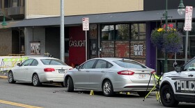 cars parked outside of a bar