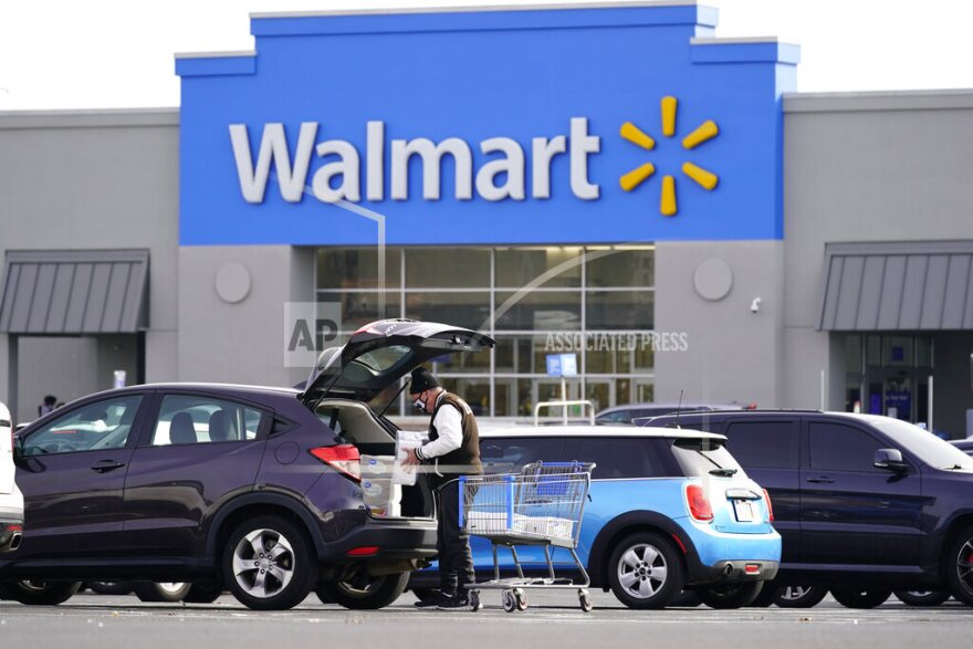 FILE - Shown is a Walmart location in Philadelphia, Wednesday, Nov. 17, 2021. Walmart, the nation’s largest retailer, on Wednesday, June 22, 2022, is expanding its healthcare coverage of so-called doula services beyond its workers in Georgia to Louisiana, Indiana and Illinois in an effort to address racial inequities in maternal care. With this move, workers can take advantage of financial support to cover care by doulas— experts who are trained to help support mothers through the labor process and delivery of the child _ up to $1,000 per pregnancy. (AP Photo/Matt Rourke)