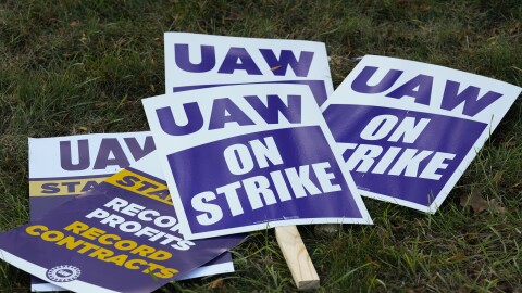 United Auto Workers signs for a strike are shown at the Stellantis Sterling Heights Assembly Plant, in Sterling Heights, Mich., Monday, Oct. 23, 2023.