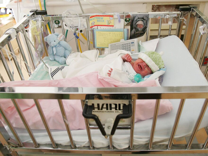 A premature baby, born at 28 weeks, lies in the neonatal intensive care unit of a New York hospital. The CDC says the large number of premature births is one factor behind the high infant mortality rate in the U.S.