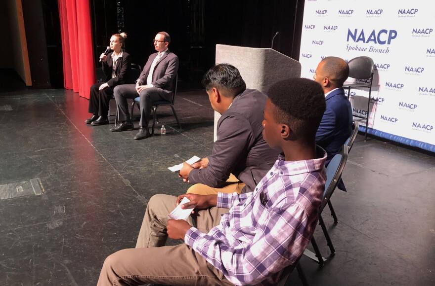 Callie Gee (left) answers a question at an October 1 NAACP forum for Spokane County auditor candidates. Gee, a Democrat, is running against Republican Michael Cathcart, seated to her left. The panelists asking the questions were Jorge Guerrero (brown suit), Kingsley Ugorji (plaid shirt) and Quentin Baker (blue suit).