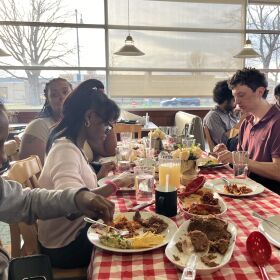 Students at Garden of Joy cook a meal to share with volunteers, family and friends. This one includes enchiladas, refried beans and grapefruit juice.