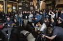 Fans and camera crews surround the band Madisen Ward and the Mama Bear's performance 