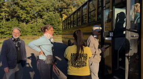 Christian and Melinda Krokus and Jill Baer head onto a bus tour of proposed data center campuses in Archbald. Tamara Misewicz-Healey, cofounder of the Stop Archbald Data Centers group, stands in the yellow shirt.