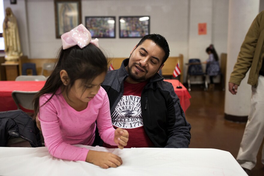 Garcia spends time with Dana, 7, after Sunday Mass at Our Lady of Guadalupe. Nov. 19, 2017