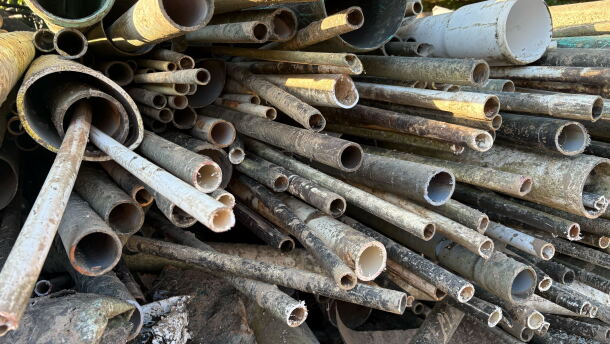 MountainTrue debris removal workers recently pulled these PVC pipes from the French Broad River, a year and a half after they were washed into it by Helene.