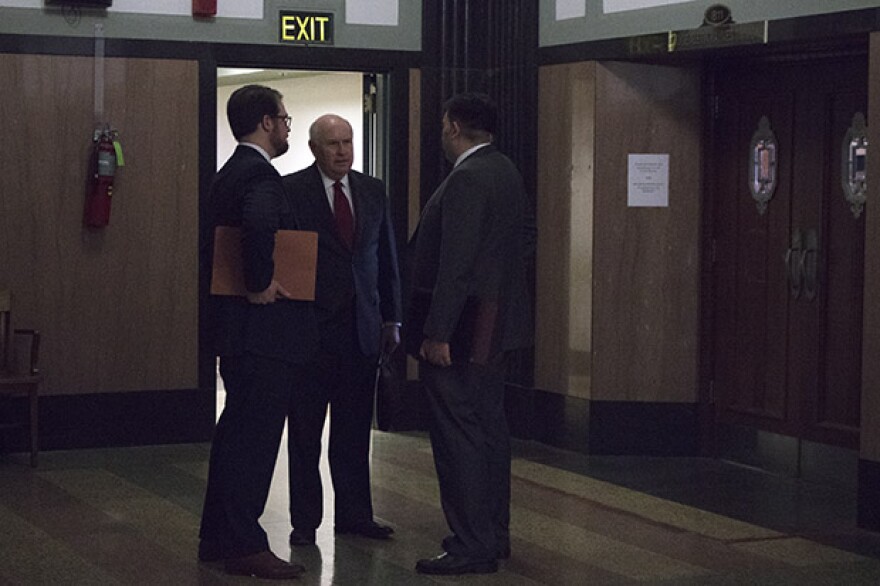 Center for Media and Democracy attorney Robert Nelon, center, outside a courtroom in Oklahoma City on Feb. 16, 2017.