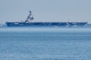 The USS Gerald R. Ford aircraft carrier leaves Naval Station Norfolk, June 23, 2025, in Norfolk, Va.