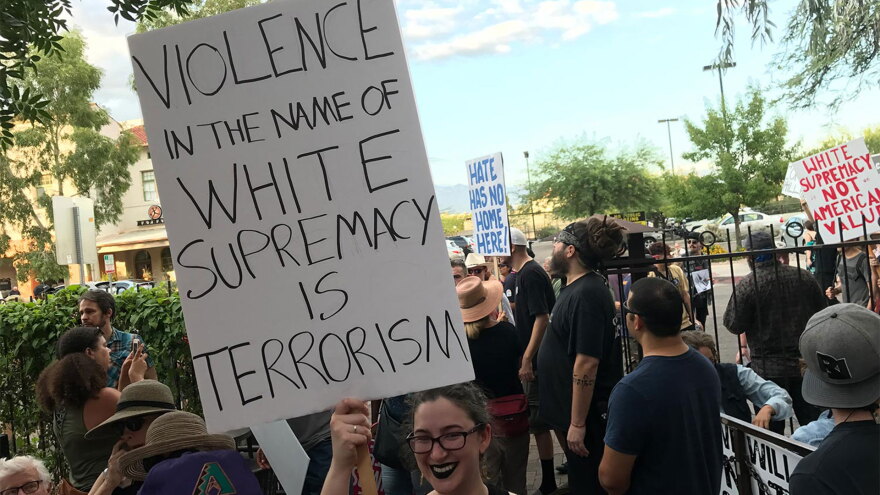 Tucson march sign hero