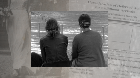 two women sitting next to each other outside