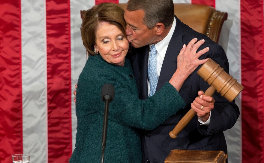 FILE - House Speaker John Boehner of Ohio, kisses House Minority Leader Nancy Pelosi of Calif. after being re-elected to a third term during the opening session of the 114th Congress, as Republicans assume full control for the first time in eight years, Jan. 6, 2015, on Capitol Hill in Washington. AP Photo/Pablo Martinez Monsivais, File)