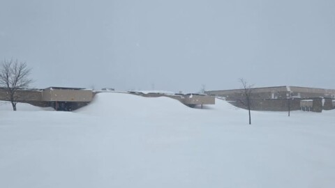 A side entrance to Cheboygan High School on Monday, March 16, 2026. Much of northern Lower Peninsula and eastern Upper Peninsula are under a blizzard warning through Tuesday morning.