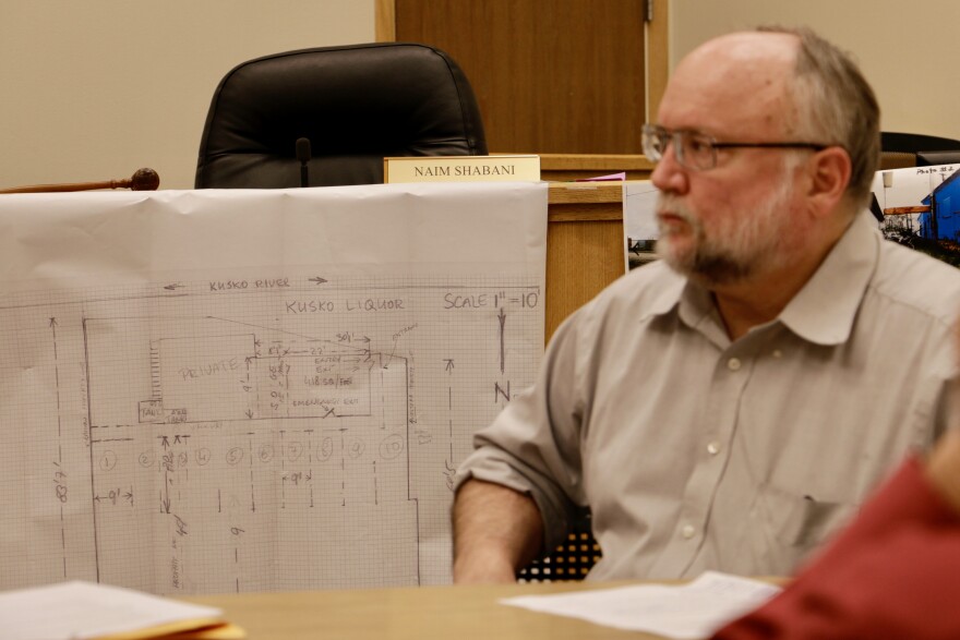 Plans for Kusko Liquor depict Cezary's Auto demolished, and in it's place 10 new off-street parking spots. City Planning Director Ted Meyer is pictured on the right in a photo taken July 13, 2017. 