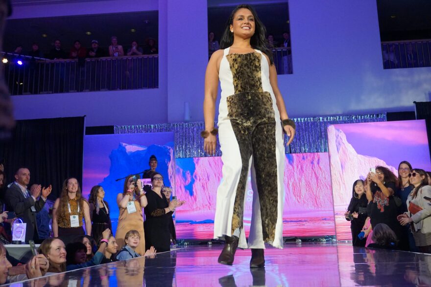 A model poses on the catwalk at the Far North Fashion Show, held April 15, 2026, at the Anchorage Museum. The fashion show is part of the annual Arctic Encounter Summit.