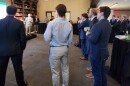 Attendees watch a Florida DOGE panel in Washington, D.C.