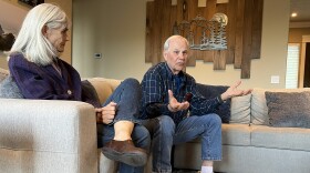 Citizens for Responsible Government President Larry West explains the proposed new charter at a neighborhood meeting. Group member Jane Slama is on the left.