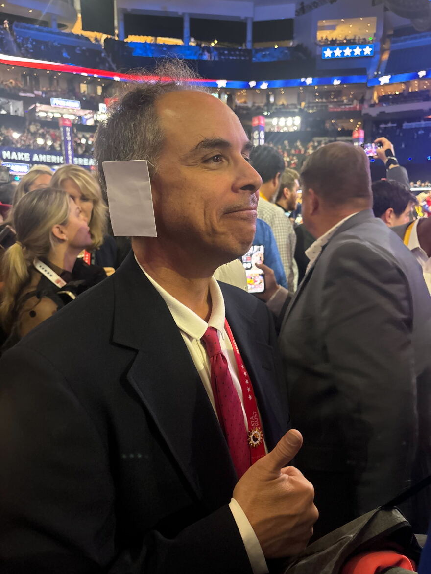 Joe Neglia of Tempe, Ariz., is pictured at the Republican National Convention in Milwaukee, Wis., on Tuesday. He says he’s wearing a bandage in solidarity with Trump.