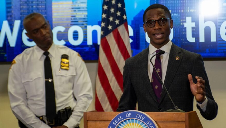  Cleveland Mayor Justin Bibb at a news conference podium with Police Chief Wayne Drummond.
