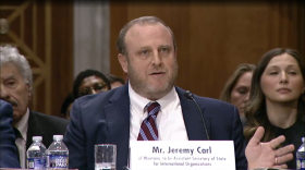 Jeremy Carl answers questions during a Feb. 12 confirmation hearing of the U.S. Senate Foreign Relations Committee. Carl, a nominee for a top State Department job, is facing bipartisan backlash after over past statements senators called racist and anti-Semitic.