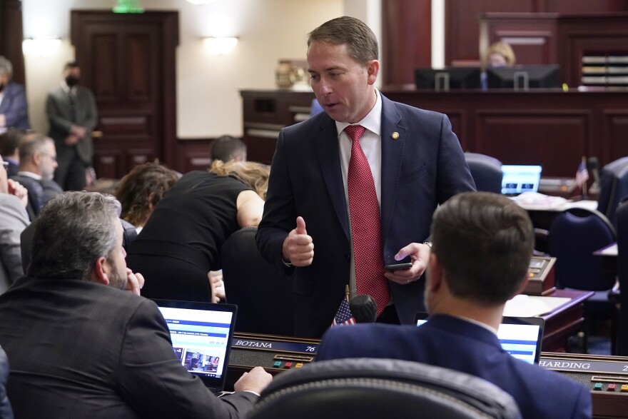 Rep. Jason Shoaf, R-Port St. Joe, talks with lawmakers during the legislative session on April 29, 2021, at the Capitol in Tallahassee, Fla.