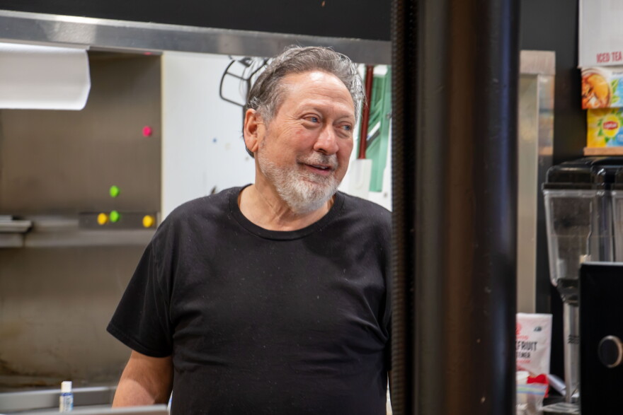 Dale Trujillo talks to a customer at No Cow Bakery and Cafe in Edmond. His restaurant has options for people with alpha-gal syndrome and other allergies.