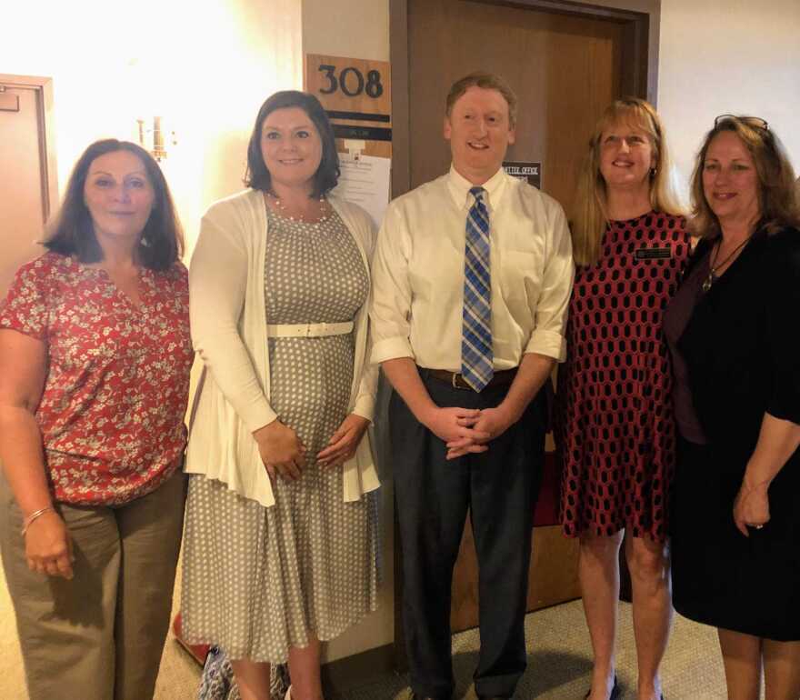 Supporters of the new rules posed for a photo after the committee's decision. From left to right: Laurene Allen of Merrimack Citizens for Clean Water; Andrea Amico of Testing for Pease; Senate Majority Leader Dan Feltes; state Rep. Nancy Murphy of Merrimack; and former state Rep. Mindi Messmer.