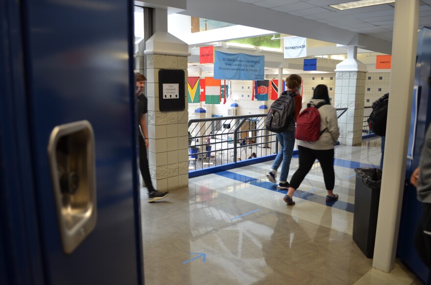 Kids walk to class in the hallway of Worthington Kilbourne High School. All students will be back in the district's schools for in-person learning starting March 22.