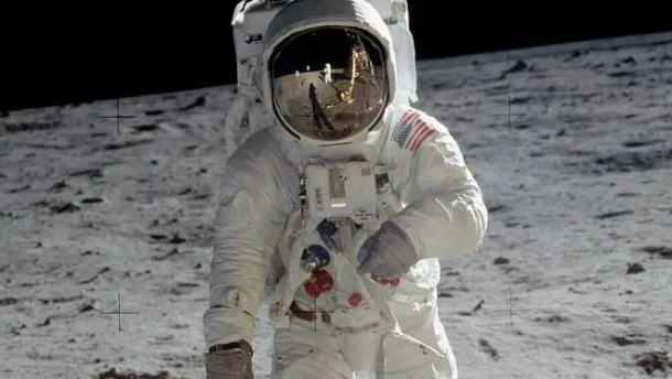 Apollo 11 astronaut Neil Armstrong reflected in the faceplate of Buzz Aldrin on the moon