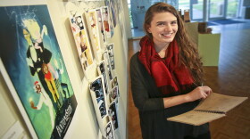 Beka Duke displays pages from her FantomeStein graphic novel in progress at Southern Arkansas University.