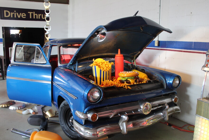 Inside John Miller's workshop. “There are diner booths that are the actual pedestals for the work. There’s a ‘54 Ford Mainline I bought without an engine and transmission so I can make it a rolling art piece. … I also use ‘50s kitchen tables to show the work as well,” Miller said.