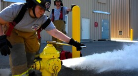 Career and technical education students train in a program through school to become firefighters.