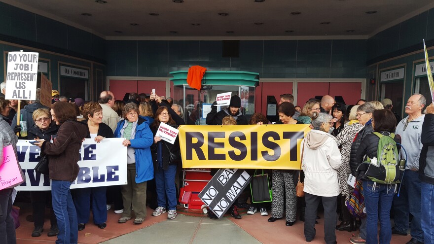 Protesters wait to get into a town hall meeting held by Rep. Tom McClintock (R-Calif.) in Roseville, Calif., on Saturday.