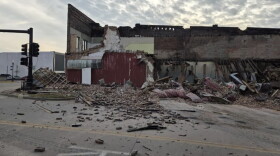 A building in Sedalia partially collapsed, leaving debris on the roadway.
