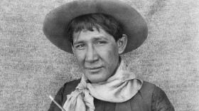 Ernest Spybuck was an Absentee Shawnee artist famous for offering glimpses into Indigenous ways of being in Oklahoma in the early 1900s. The photo was taken during fieldwork sponsored by George Heye.
