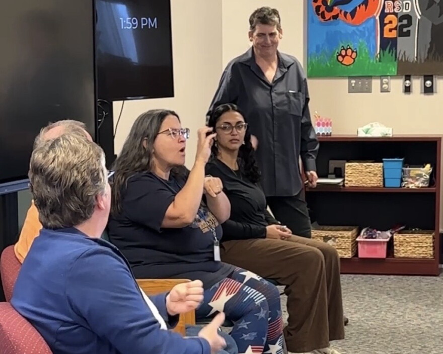 Kristen Sickler, Rochester School for the Deaf alumna and author of the book Siren of the Finger Lakes, presents at an alumni panel discussion with current students at the school's library on Friday.